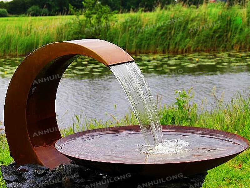 Corten steel wall fountain for cafe traders